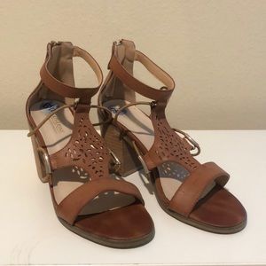 Tan heeled sandals with gold hardware detailing